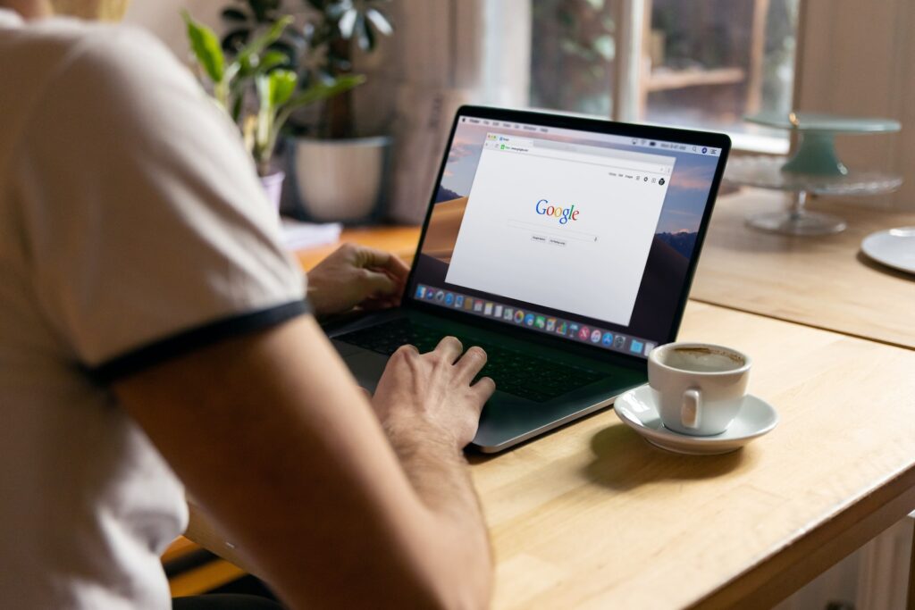 person using black laptop computer and freelancing